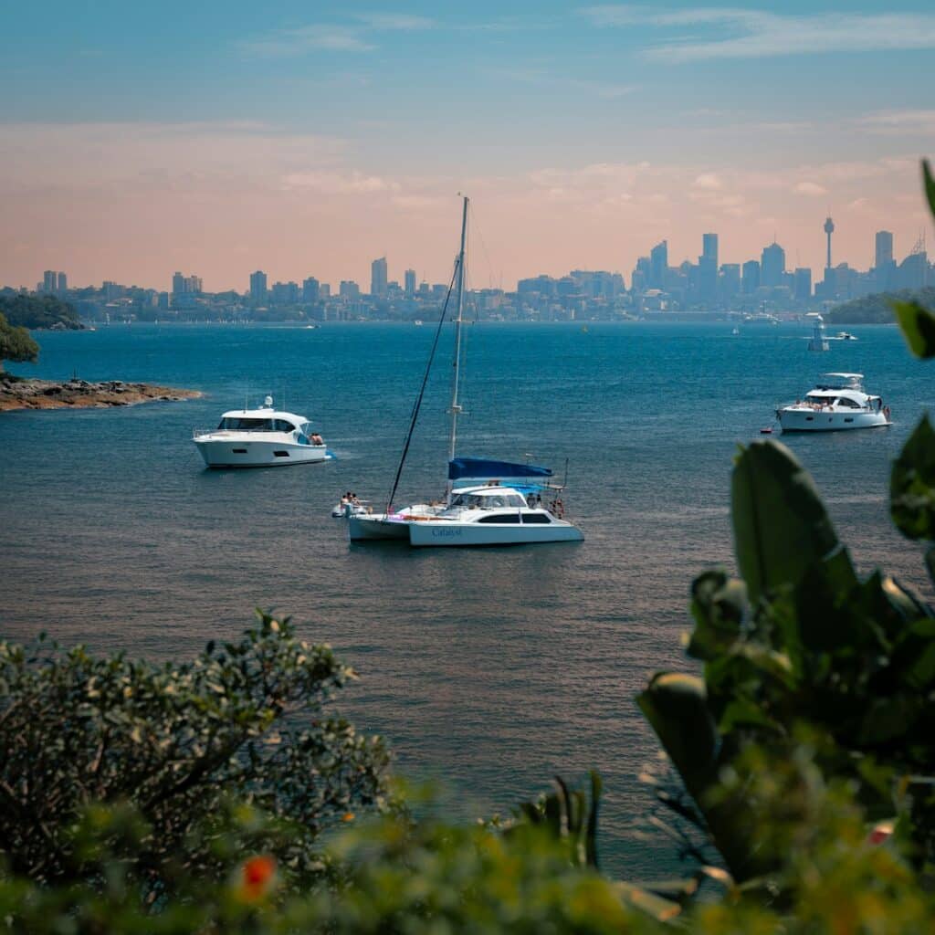 A group of boats floating on top of a body of water